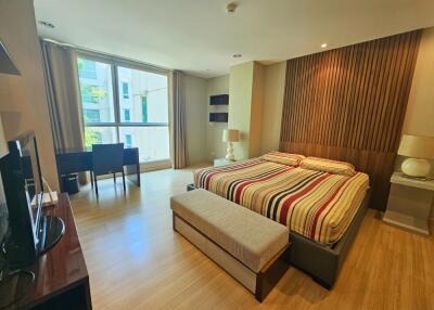 Modern bedroom with large window and natural light