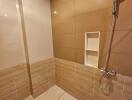 Bathroom with tiled walls and shower