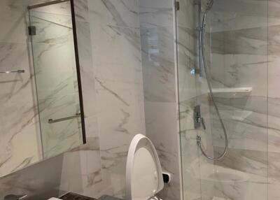 Modern bathroom with glass shower and toilet