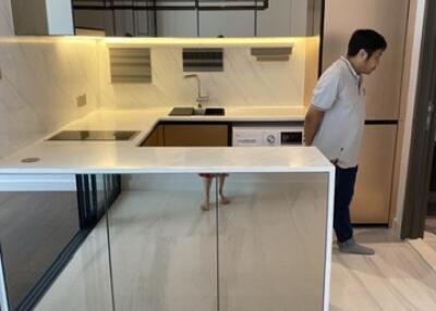 Modern kitchen with island and under-cabinet lighting