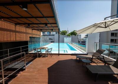 Swimming pool with lounging area