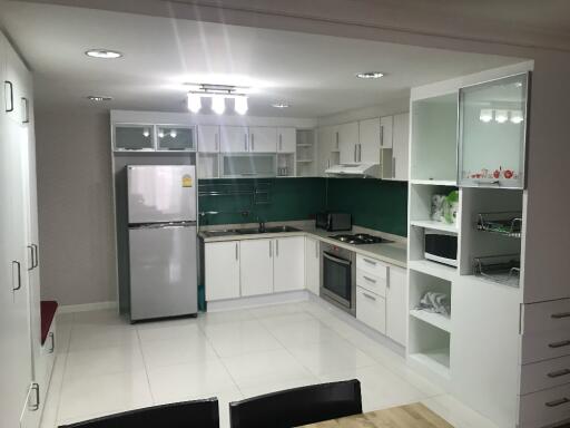 Modern white kitchen with appliances