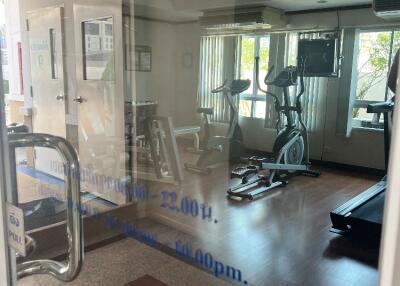 Gym with exercise equipment and natural light