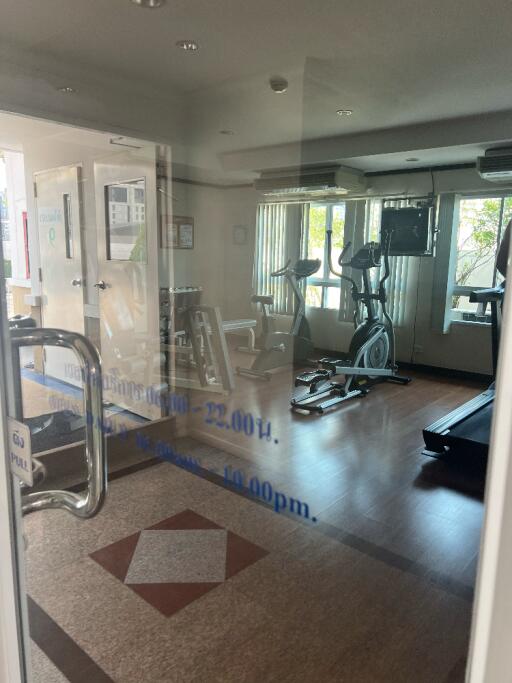 Gym with exercise equipment and natural light