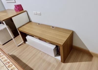 Bedroom with storage furniture and wooden flooring