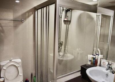 Modern bathroom with shower, toilet, and sink