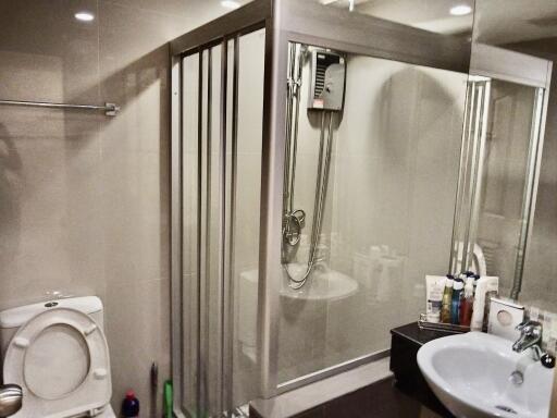 Modern bathroom with shower, toilet, and sink