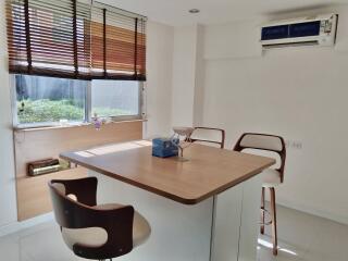 Modern Kitchen with Island and Bar Stools