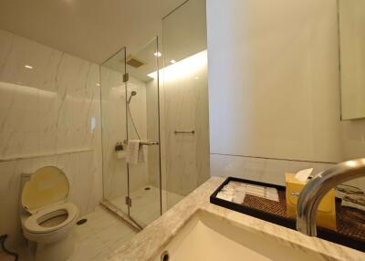 Modern bathroom with glass shower and marble sink