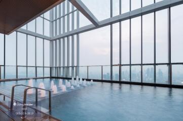 Indoor infinity pool with city view