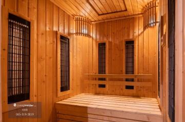 Wooden sauna with benches and heaters