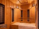 Wooden sauna with benches and heaters