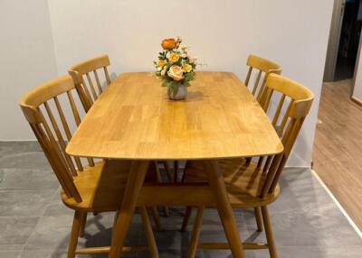 Dining area with wooden table and chairs