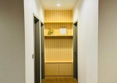 Modern hallway with wooden flooring and bright lighting