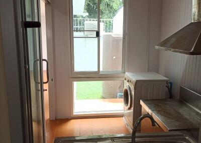 Small kitchen with a window and appliances