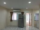 Kitchen with refrigerator and marble floor