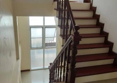 Interior staircase with wooden railing