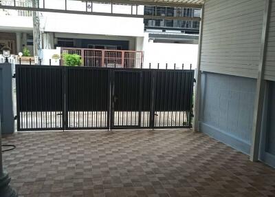 Covered garage with tiled flooring