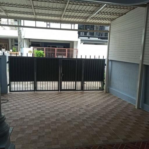 Covered garage with tiled flooring