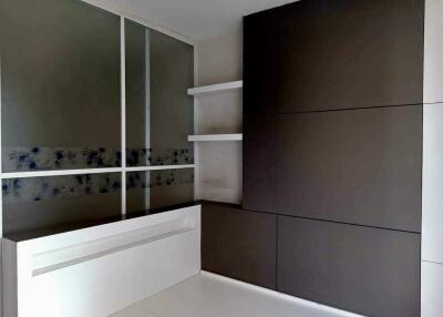 Modern bedroom with built-in storage and sliding door closet