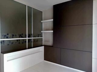 Modern bedroom with built-in storage and sliding door closet