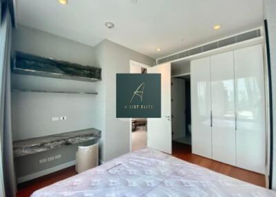 Modern bedroom with built-in wardrobe and storage shelves