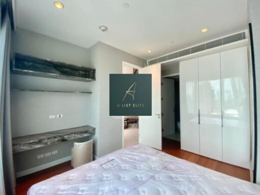 Modern bedroom with built-in wardrobe and storage shelves