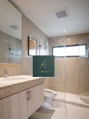 Modern bathroom with glass shower and vanity