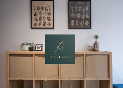 Living room with decorative wall art and storage unit