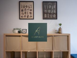 Living room with decorative wall art and storage unit