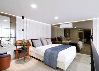 Modern bedroom with a large bed and ample lighting