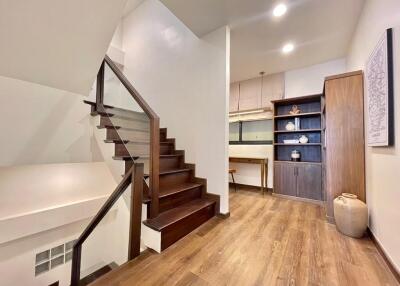 Elegant hallway with wooden staircase