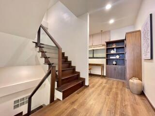 Elegant hallway with wooden staircase