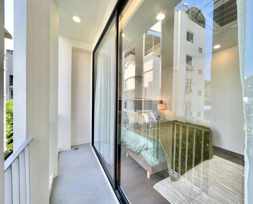 Balcony with view into a bedroom