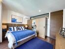 Spacious and modern bedroom with double bed and ample storage