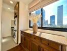 Bright laundry area with city view