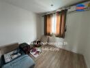 Small bedroom with wooden flooring, window with curtains, and air conditioning