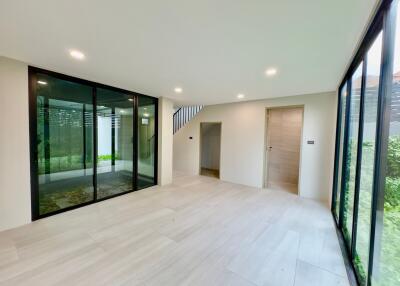 Modern living room with large windows and sliding doors