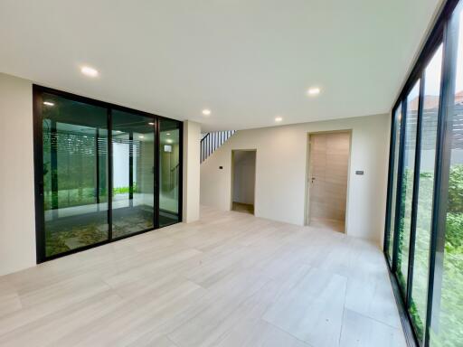 Modern living room with large windows and sliding doors