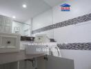 Modern bathroom with tiled walls and a large mirror