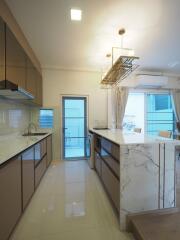 Modern kitchen with marble countertops and kitchen island