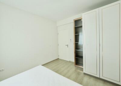 Minimalistic bedroom with a wardrobe