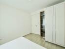 Minimalistic bedroom with a wardrobe