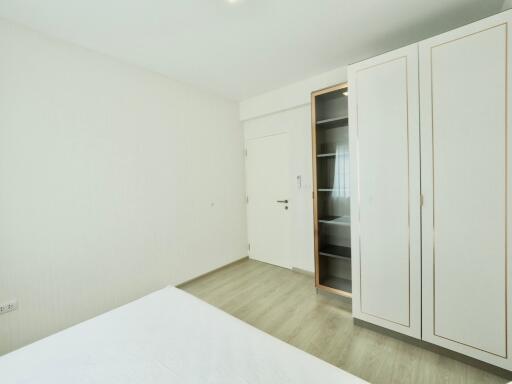 Minimalistic bedroom with a wardrobe