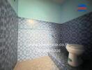 Bathroom with blue tiles and a toilet