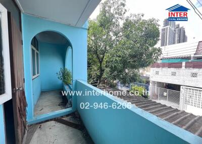 Blue balcony of residential building with city view