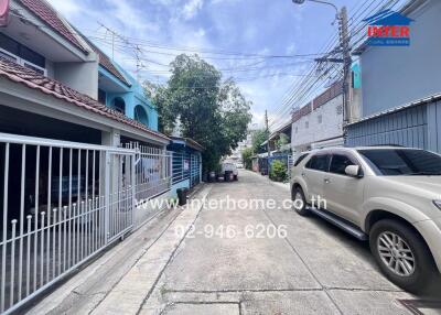 Residential street with houses and parked cars