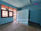 Empty room with blue walls and a window