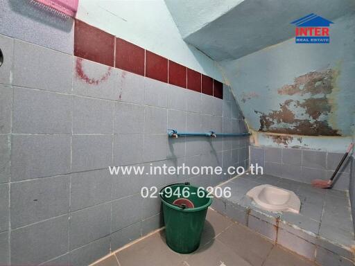 Bathroom with basic amenities and visible maintenance issues