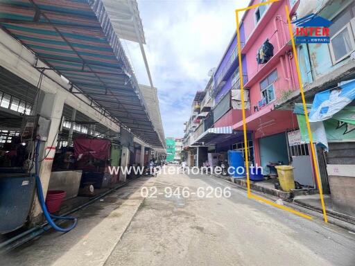 Street view of a row of buildings showcasing a residential area